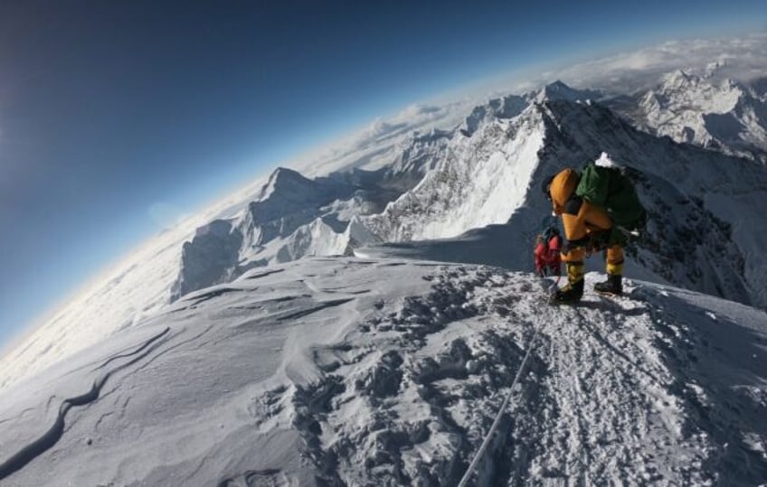Mountaineers make their way to the summit of Mount Everest, as they ascend on the south fa