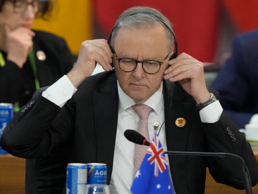 Australia's Prime Minister Anthony Albanese adjusts his headphones during the G20 Sum