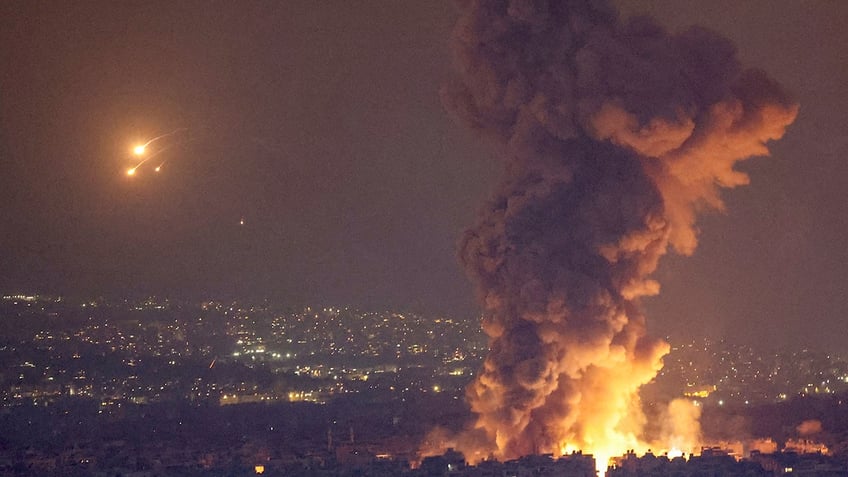 Smoke and flames rise in Beirut's southern suburbs, after Israeli air strikes, amid ongoing hostilities between Hezbollah and Israeli forces, as seen from Sin El Fil, Lebanon, October 6, 2024. 