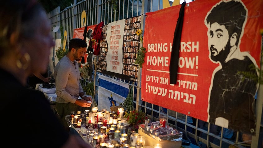 People light candles during a vigil in memory of slain hostage Hersh Goldberg-Polin in Jerusalem, Israel, on Sunday, Sept. 1, 2024.