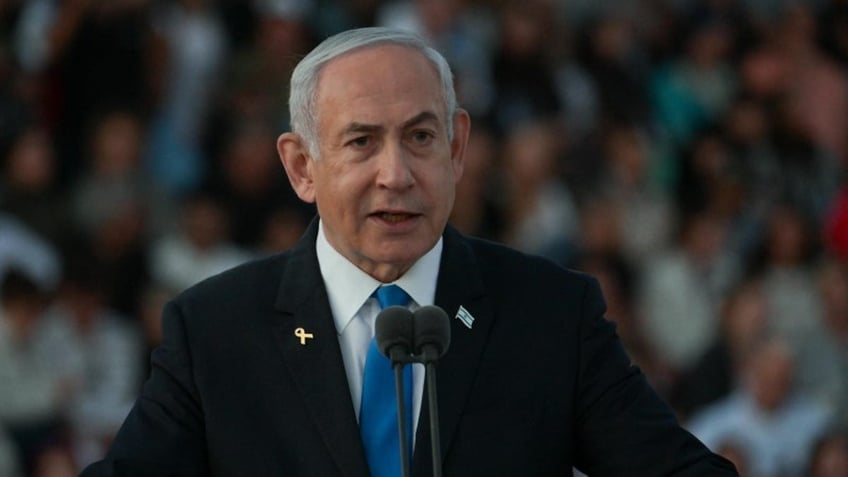 Prime Minister Benjamin Netanyahu speaks at the IDF Officers Course graduation ceremony at an IDF training base.