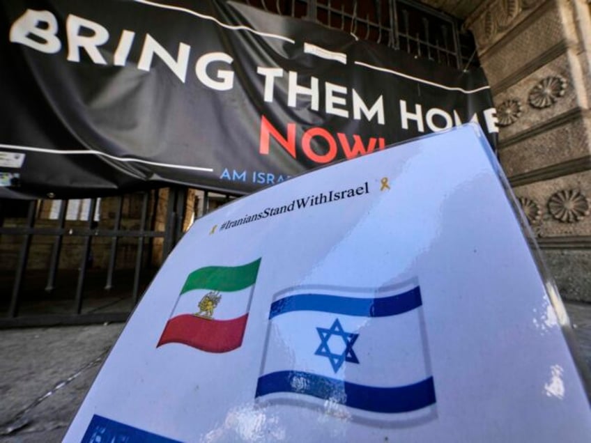 A sign with an Iranian and Israeli flag that was set up up a while ago is pictured at the