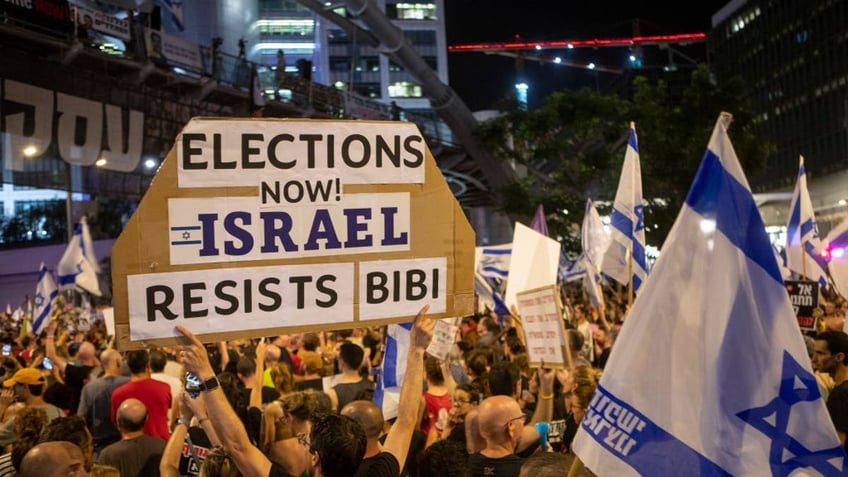 TEL AVIV, ISRAEL - JUNE 15: Thousands of Israelis demand Prime Minister Benjamin Netanyahu's resignation and the immediate release of Israeli hostages from Hamas captivity on June 15, 2024 in Tel Aviv, Israel. Anti-government protests have taken place almost weekly in the past eight months, amid frustration with the Netanyahu government and its failure to secure the release of the remaining 120 Israeli and foreign hostages kidnapped by Hamas to the Gaza Strip on October 7, 2023. (Photo by David Silverman/Getty Images)