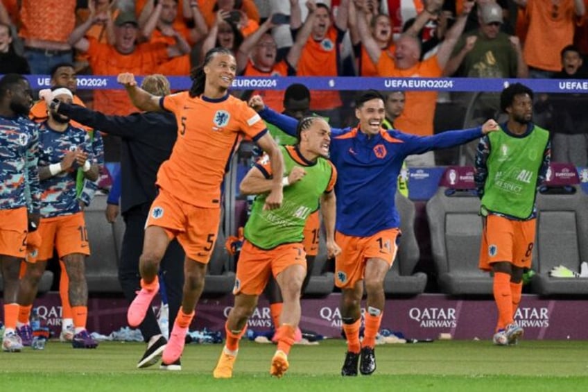 Netherlands players celebrate their Euro 2024 last-eight victory over Turkey, which booked