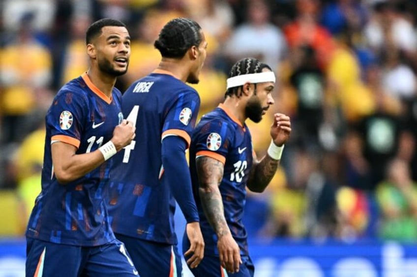 Cody Gakpo celebrates scoring the opening goal for the Netherlands in their last-16 victor