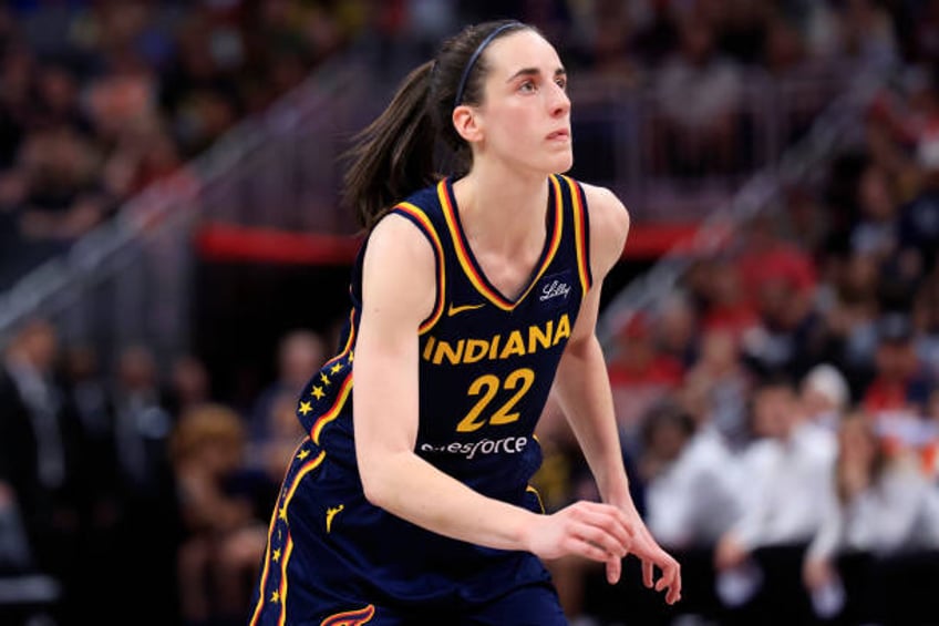 Caitlin Clark of the Indiana Fever looks on in the game against the Los Angeles Sparks at Gainbridge Fieldhouse on May 28, 2024 in Indianapolis,...