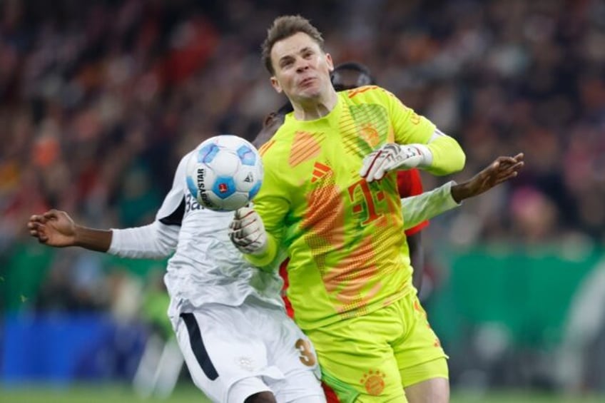 Manuel Neuer (front) fouls Bayer Leverkusen's Jeremie Frimpong, earning a red card and suf