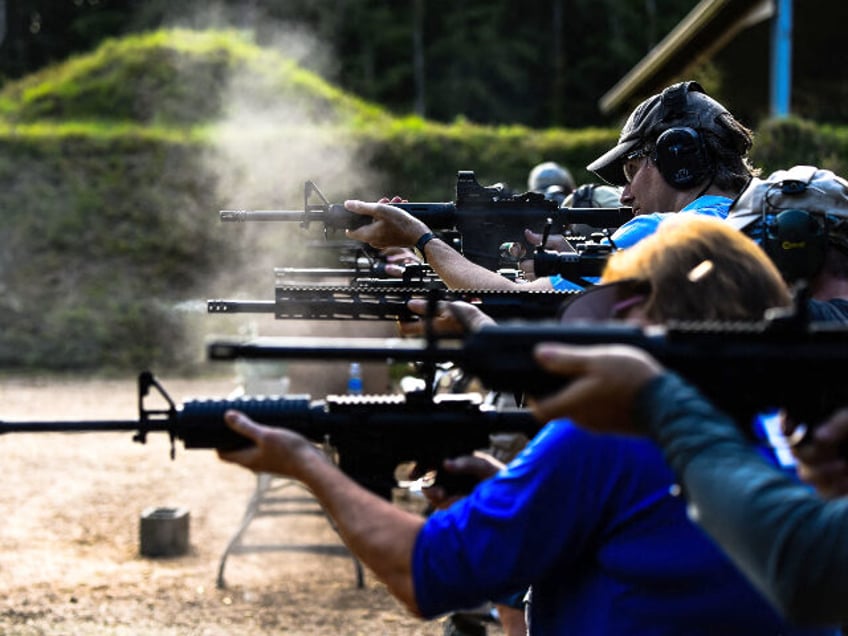 Students fire AR-15 semi-automatic rifles during a shooting course at Boondocks Firearms A
