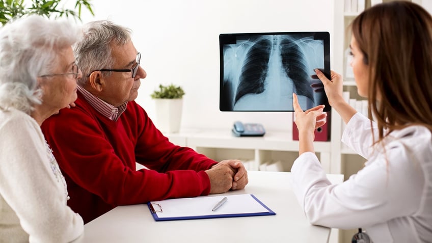 Older couple chest X-ray