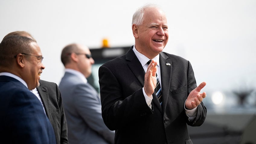 Minnesota Governor Tim Walz clapping