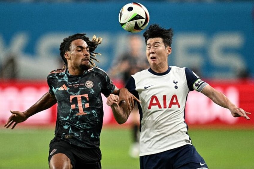 Tottenham captain Son Heung-min and Bayern Munich's Sacha Boey vie for the ball in Seoul