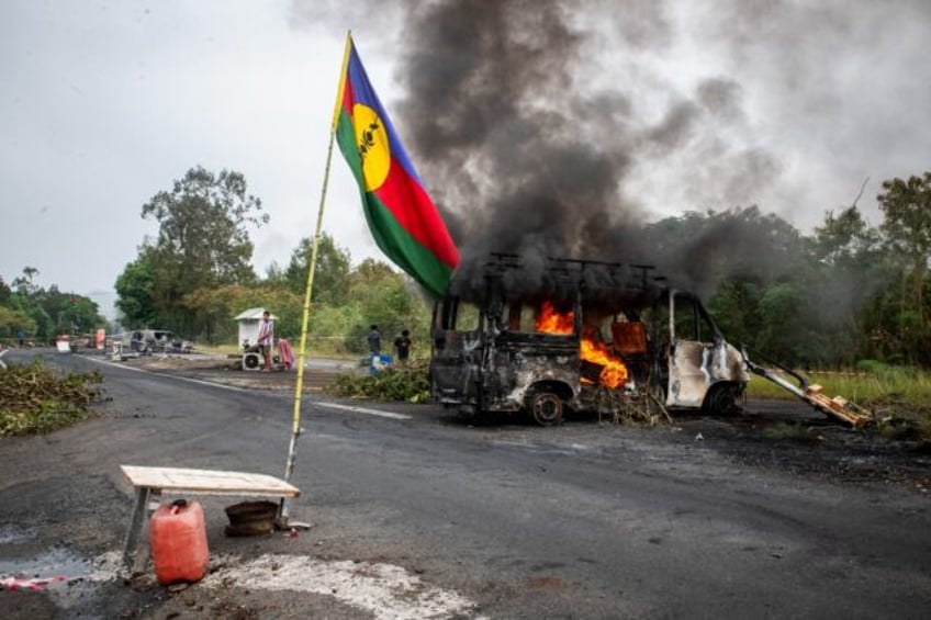 French forces smashed through dozens of barricades in a bid to retake the main road to New