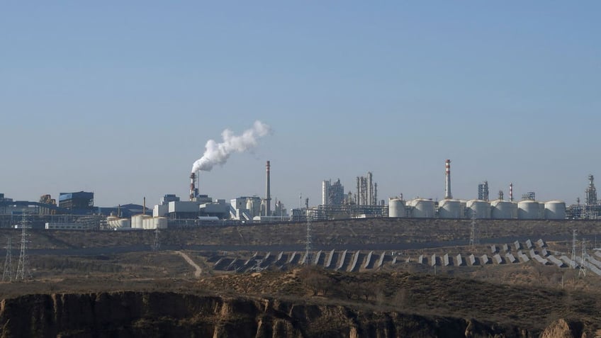 Solar panels lie in front of factories at Jinjie Industrial Park in China