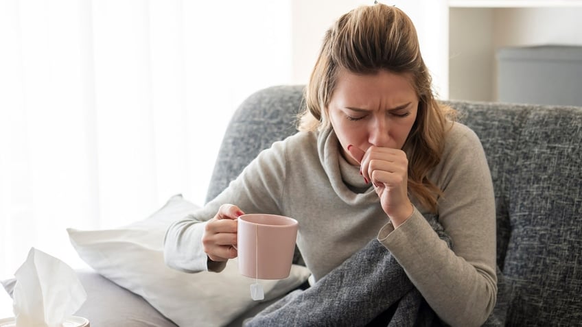 Woman coughing