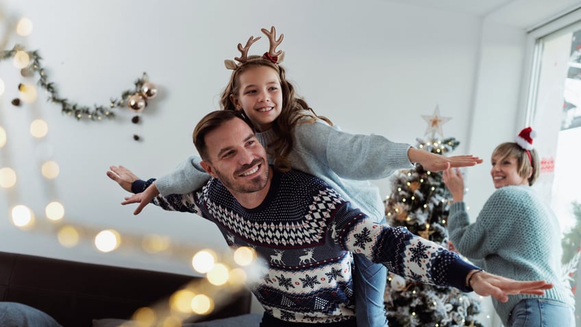 dad with daughter on christmas