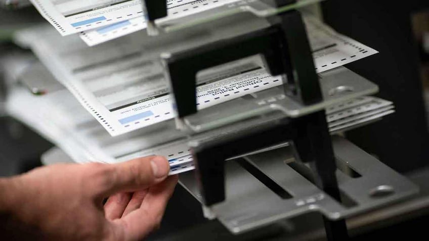 Polll workers sorting out absentee ballots