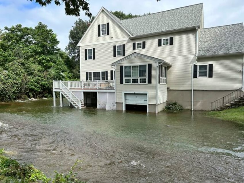 new england braces for more rain after hourslong downpour left communities flooded and dams at risk