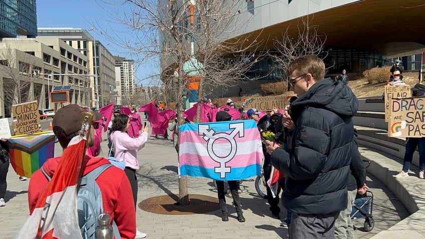 Nathaniel Pawlowski reading Bible to protesters