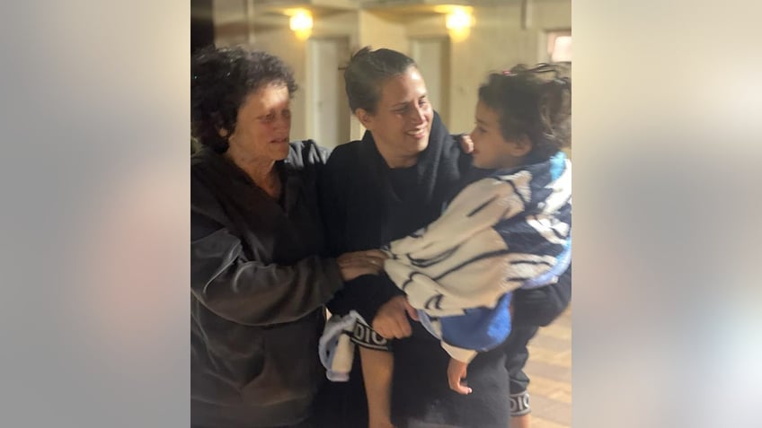 new images of avigail idan show released 4 year old us citizen smiling reunited with family members