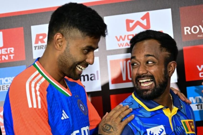 Sri Lanka's captain Charith Asalanka (R) and his Indian counterpart Suryakumar Yadav at a