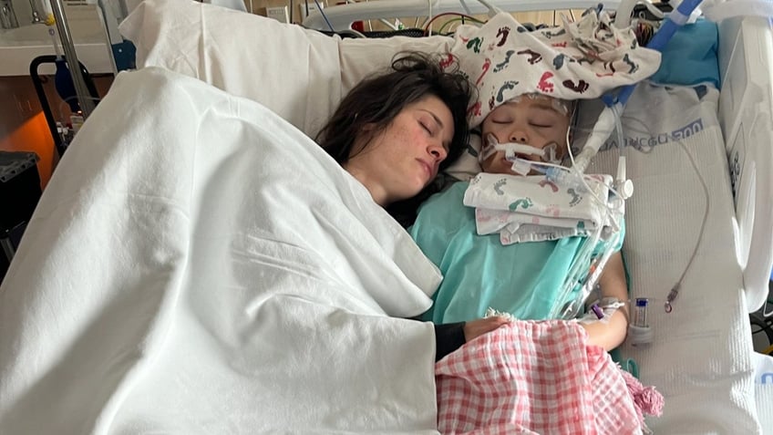 Lucy Morgan and her mother in a hospital bed sleeping