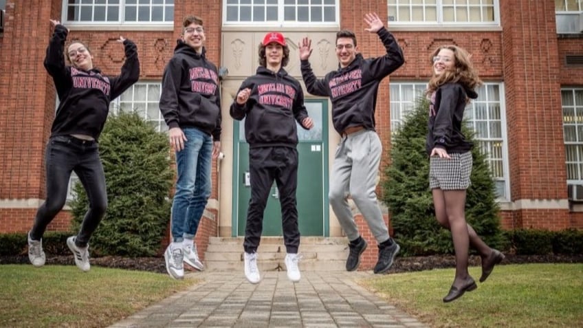 Quintuplets jumping mid-air