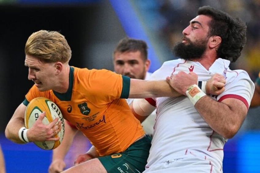 Australia's Tate McDermott is tackled by Georgia's Vladimer Chachanidze in Sydney