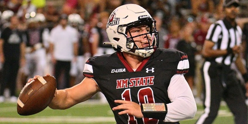 new mexico states diego pavia tries to make play with helmet twisted around