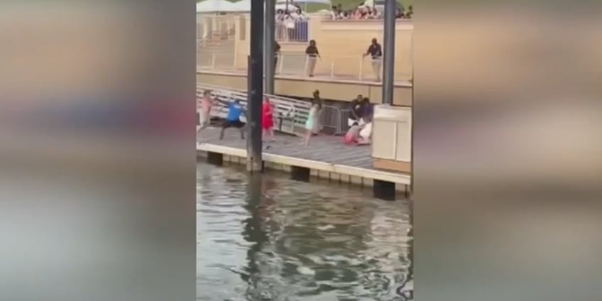 new montgomery riverfront brawl footage emerges with two suspects still on the lam