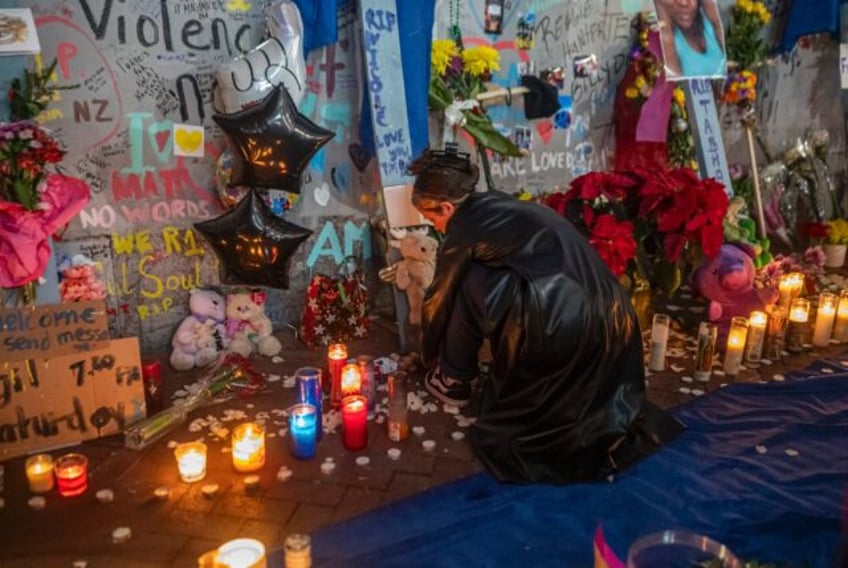 Mourners hold a vigil on Bourbon Street for the 14 victims killed in a January 1, 2025 tr