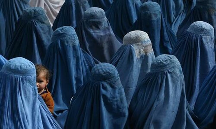 new taliban vice laws forbid women from looking at men singing in public solo travel