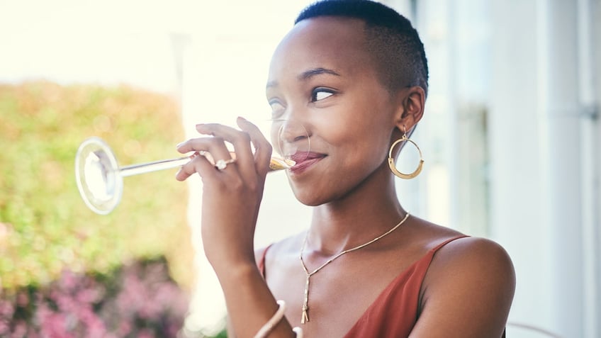 woman drinks champagne