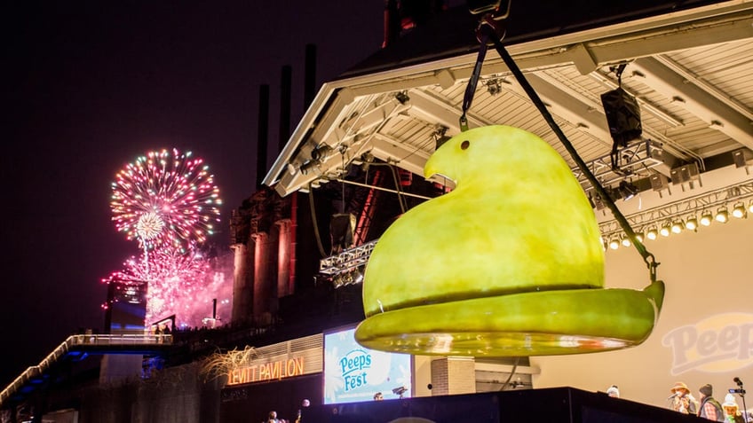 A giant PEEPS Chick being lowered.