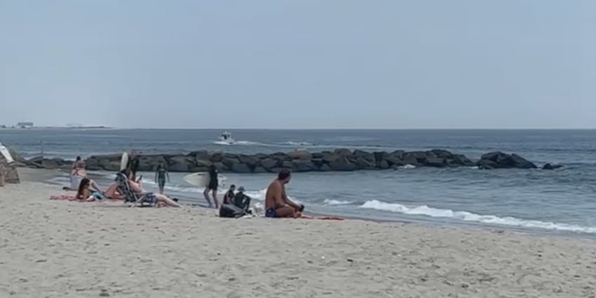 new york beachgoers pulled from water days after woman attacked by shark lost 20 ibs of flesh