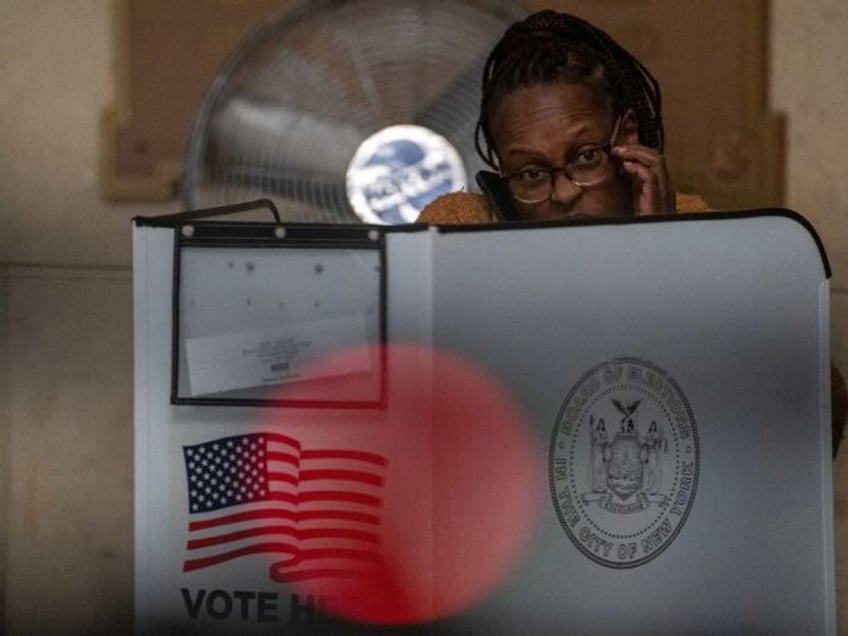 A woman votes at a polling station in the Bronx borough of New York City on Election Day,