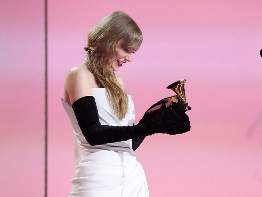 LOS ANGELES, CALIFORNIA - FEBRUARY 04: Taylor Swift accepts the Best Pop Vocal Album award for “Midnights” onstage during the 66th GRAMMY Awards at Crypto.com Arena on February 04, 2024 in Los Angeles, California. (Photo by Kevin Mazur/Getty Images for The Recording Academy)