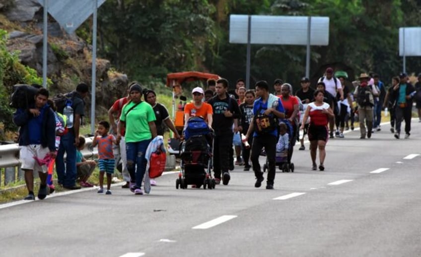 Migrants take part in a caravan towards the border with the United States in Mapastepec, in the Chiapas state of Mexico