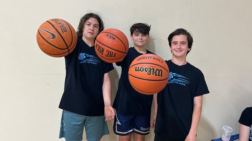 teller and friends on the basketball court