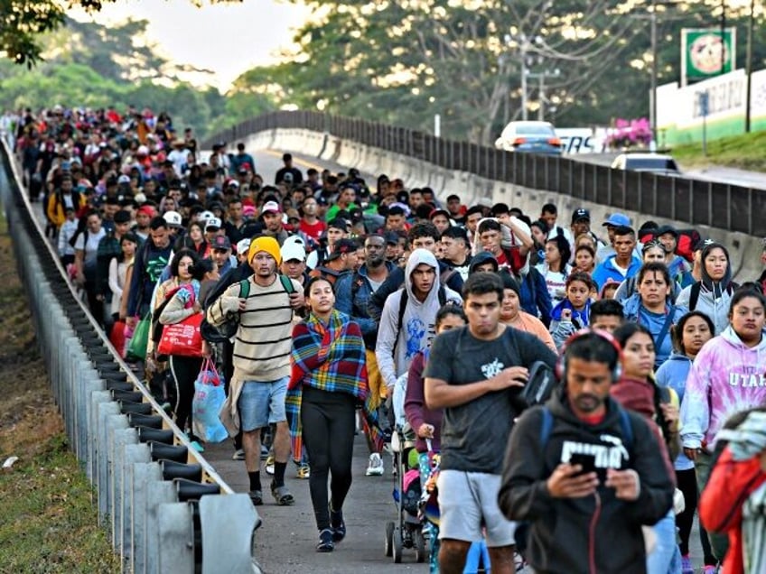 Migrants from a caravan in Tapachula, Chiapas state, Mexico, march while heading to the US