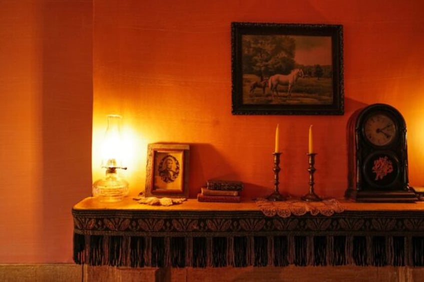 A mantelpiece holds a portrait of president Abraham Lincoln in the recreated dwelling of Joseph and Rachel Moore at the Tenement Museum