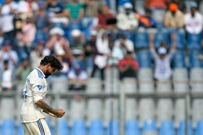 India's Ravindra Jadeja celebrates the wicket of New Zealand's Glenn Phillips