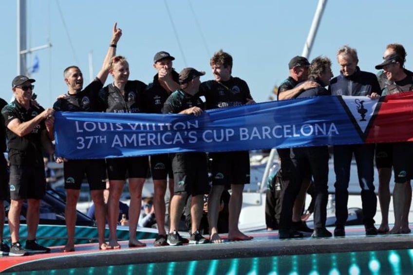 The crew of Emirates Team New Zealand savour victory in the America's Cup