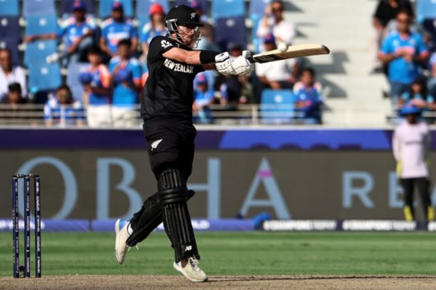 Mitchell Santner made eight late in New Zealand's innings before taking two wickets with h