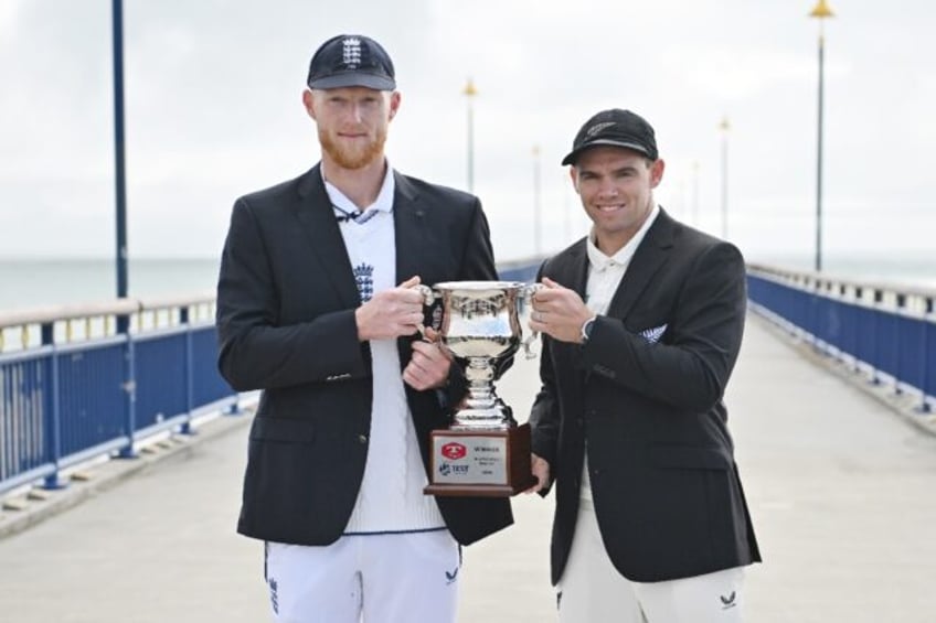 New Zealand's Tom Latham (right) and England's Ben Stokes pose with the series trophy