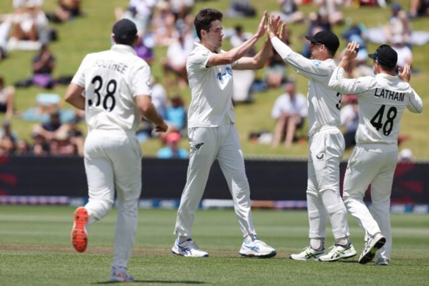 New Zealand's Will O'Rourke (centre) celebrates the wicket of England's Harry Brook on the