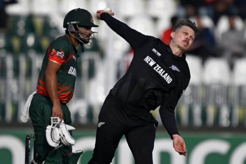 Michael Bracewell (R) took 4-26 as New Zealand limited Bangladesh to 236-9 in the Champion