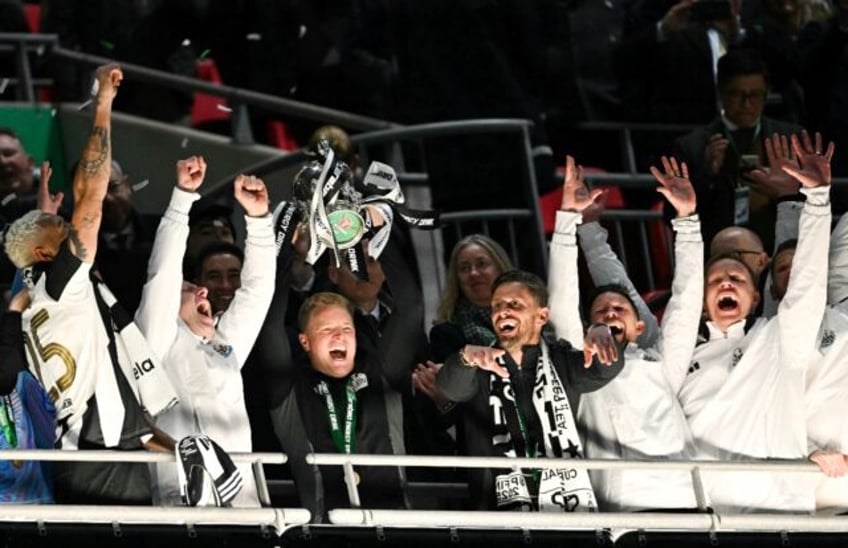 Newcastle boss Eddie Howe lifts the League Cup trophy