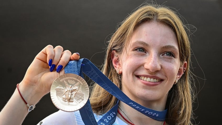 Romanian gymnast Ana Maria Barbosu poses with her Olympic bronze.