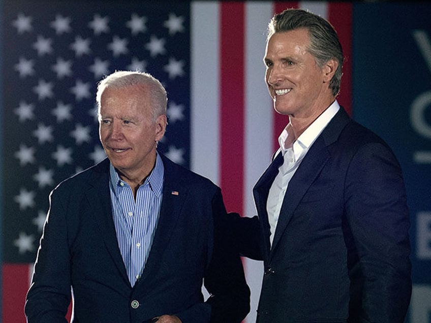 California Governor Gavin Newsom (L) greets US President Joe Biden during a campaign event at Long Beach City Collage in Long Beach, California on September 13, 2021. - US President Joe Biden kicked off a visit to scorched western states Monday to hammer home his case on climate change and …