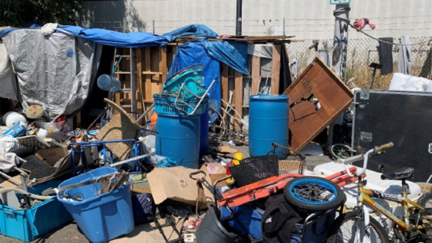 homeless camp in Berkeley, shot showing mess